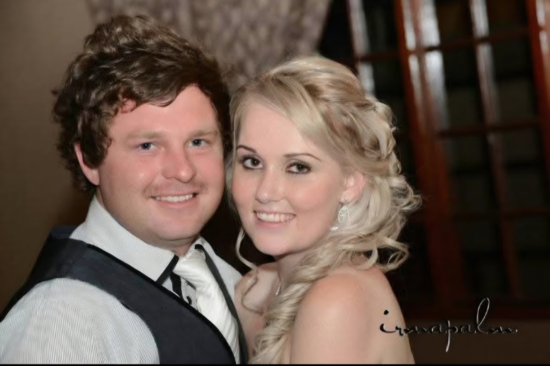 Angelo and a friend dressed up together at a formal evening event