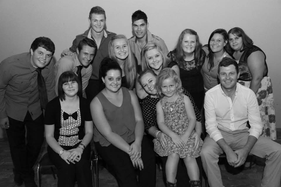 A black and white group portrait of family members of all ages