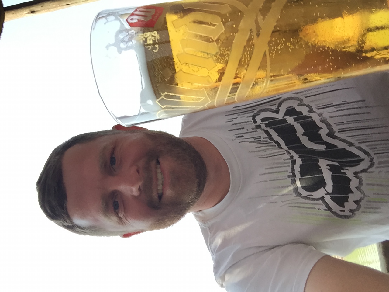 Angelo taking a selfie beside an oversized beer glass