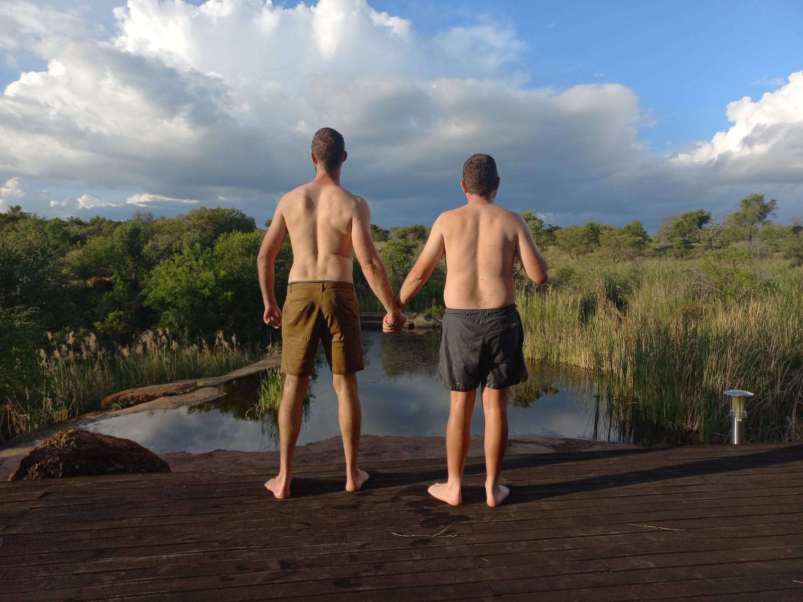 Angelo and his best friend looking out over the bushveld from the deck